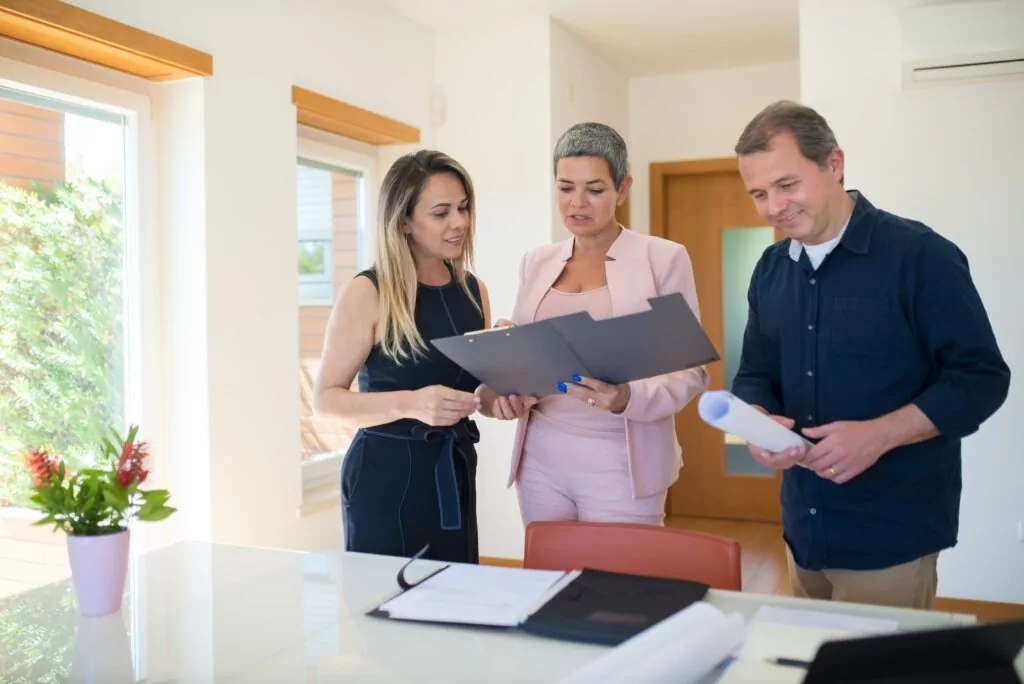 real estate agent assisting clients