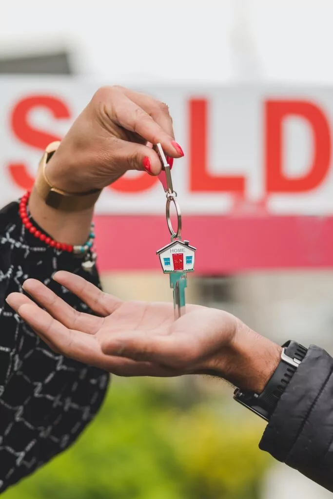 real estate agent giving keys to client